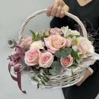 Delicate bouquet with cream roses and eucalyptus twigs